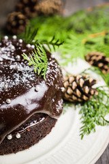 Creamy cake with chocolate glaze on the rustic background. Selective focus. Shallow depth of field.