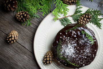 Creamy cake with chocolate glaze on the rustic background. Selective focus. Shallow depth of field.