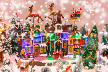 Santa Claus, Christmas tree and toys at a Christmas souvenir market shop in Strasbourg, Alsace, France