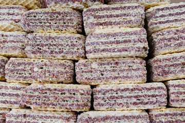 Creamy wafer biscuit texture. Neapolitan wafers are a wafer and chocolate cream sandwich biscuit. Sweets square wafer pattern studio food photography . Stack of wafers.