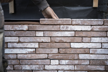 macon placing bricks