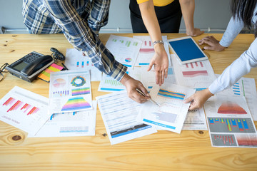 Business consultant is checking and analysis sales figures to plan business strategies with the...