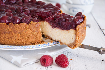 Homemade cheesecake with cherries on a plate