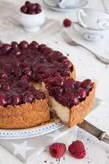 Homemade cheesecake with cherries on a plate