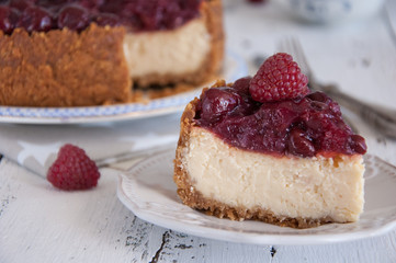 Homemade cheesecake with cherries on a plate
