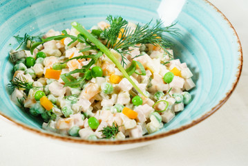 russian salad in the blue bowl