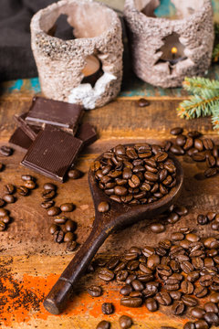 Dark roasted pure arabica coffee beans and ground coffe on the wooden table, copy space