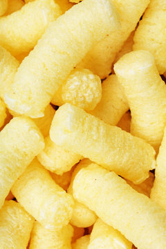 Cheese puff. Cheese puffs snack background texture food pattern. Texture background.