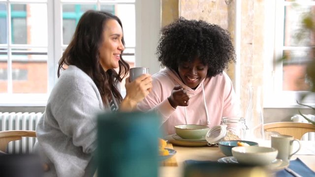 Two girlfriends having breakfast