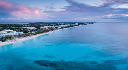 Deurstickers Seven Mile Beach, Grand Cayman aerial panoramic view of seven mile beach in the tropical paradise of the cayman islands in the caribbean sea after sunset