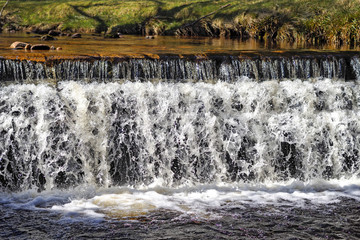 Waterfall flowing into lake