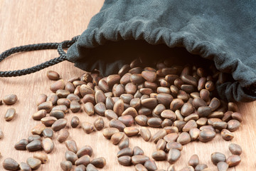 Pine nuts, pouring out of the bag.