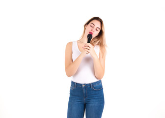 Young cute girl with microphone, isolated  