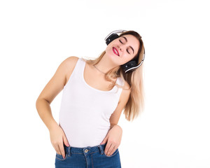 Naklejka premium Young cute girl listens music, isolated 