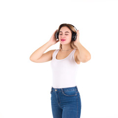 Young cute girl listens music, isolated  