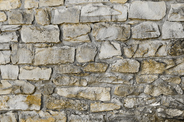 Background old wall of large stones closeup