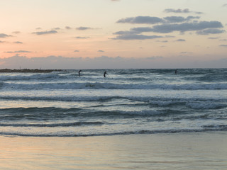 Tourists paddleboarding in the sea, Tel Aviv, Israel
