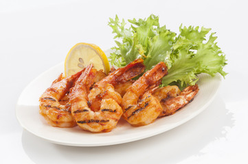 Grilled Jumbo headless shrimp with tikka marinade with lemon tomato and lettuce  