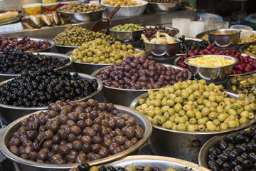 Variety of olives for sale at market stall, Carmel Market, Tel Aviv, Israel