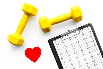 Prevent heart disease. Heart sign, cardiogram and dumbbells on white background top view