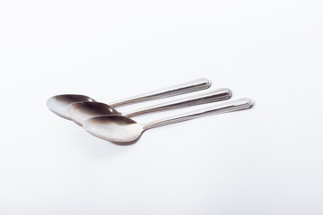 Teaspoons on a white background.