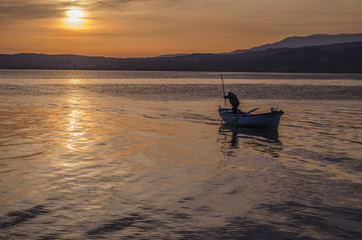 Sunset and Fisherman