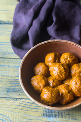 Bowl of turkey meatballs with curry sauce