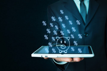 Percent symbols with piggy bank.