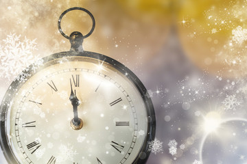 Naklejka na ściany i meble old clock at twelve o'cklock on holiday fireworks background - New Year's