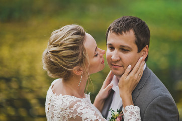 The young girl hugs the man hands over the cheeks 85.