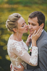 The young girl hugs the man hands over the cheeks 87.