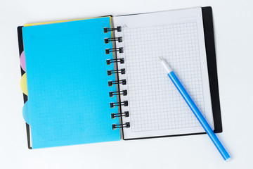 Blank note paper with pen. isolated on white.