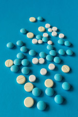 Medical medication pills on a blue background