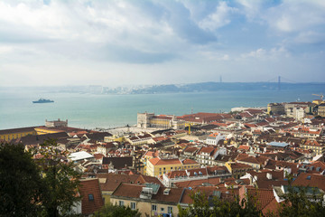 Obraz premium Lisbon from above: view of Baixa district and Rio Tejo (River Tagus) from Castelo de Sao Jorge