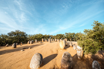 Sunrise view on the menhirs stones in megalithic monument of Cromelech dos Almendres in Portugal
