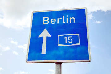 Traffic sign with direction to Berlin