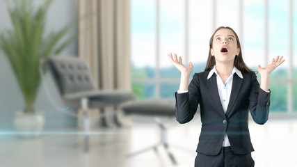 Young beautiful business woman and creative designer standing over blured interior background