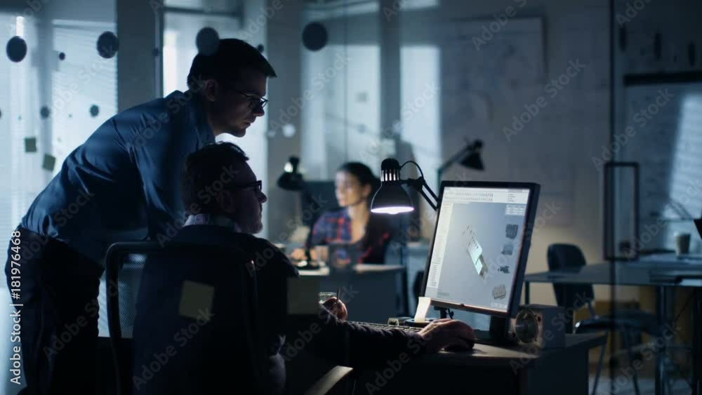 Poster late at night two industrial engineers discuss 3d component design made with cad program on personal