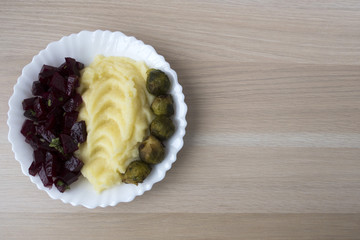 potato puree with beetroot salad and cabbage