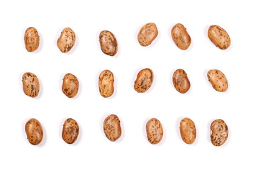 Raw brown beans isolated on white background, top view