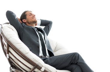 happy businessman relaxing in big comfortable armchair