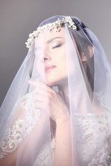 bride's portrait beauty in a veil and a wedding dress