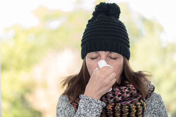 Woman blowing her nose © thodonal