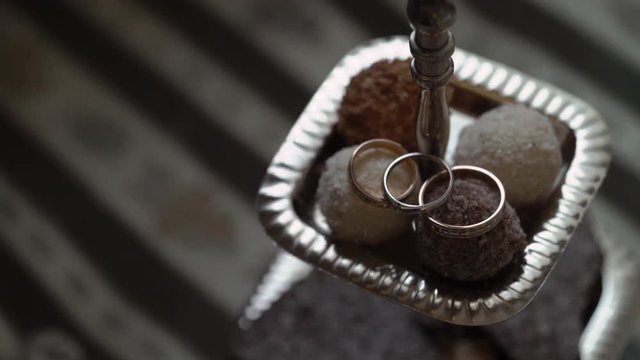 Wedding rings on cookies background