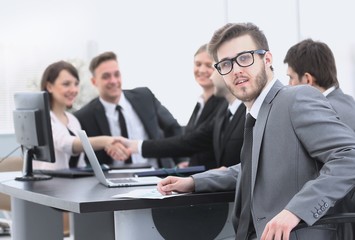 Fototapeta premium handshake business partners with the Manager in the foreground