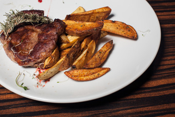 beef steak with fried potato;