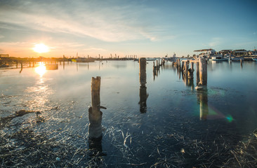 Beautiful sunset landscape with boats at the lagoon of Mesolongi, Greece 