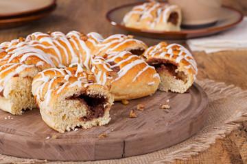 Cinnamon Pecan Danish Slices on a Wooden Platter