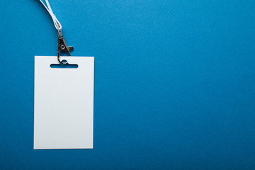 Blank badge template with strap key blue background