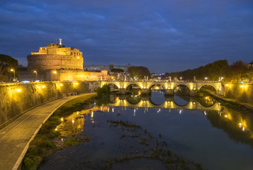 Fototapeta premium Rome (Italy) - The Tiber river and the monumental Lungotevere. Here in particular the Castel Sant'Angelo fortress
